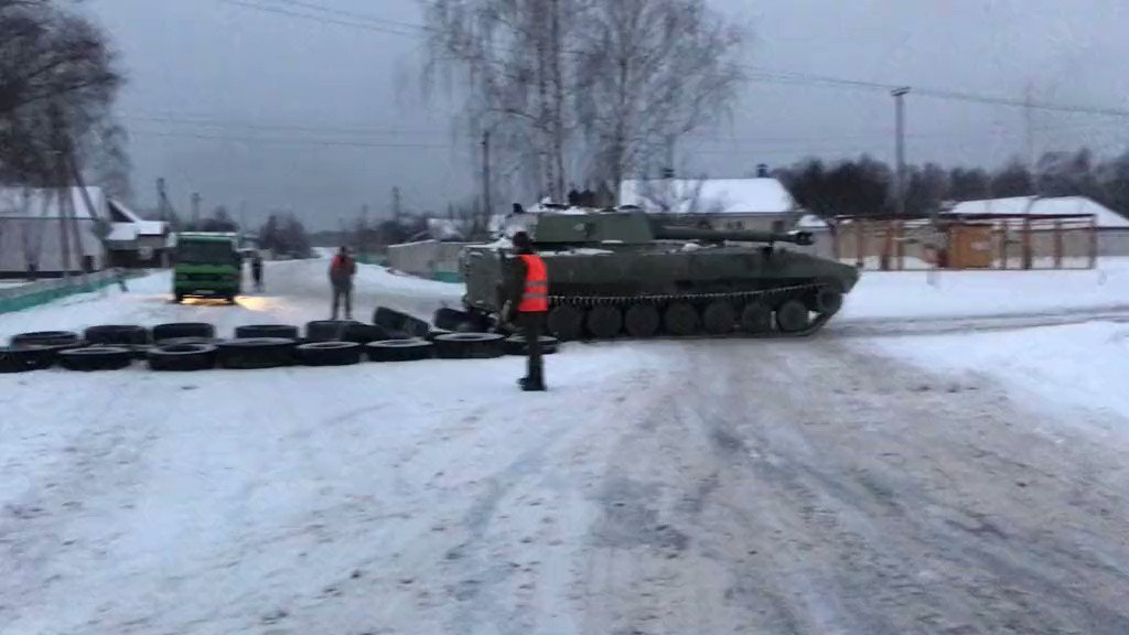 Military column crossing the road in Kamenka filmed near Mozyr
